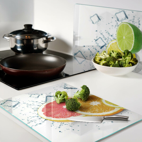 Tabla de cortar de cristal Frutas cítricas en rodajas de colores