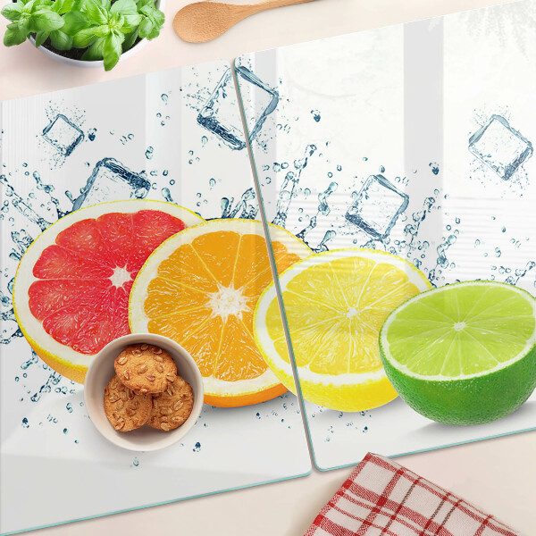 Tabla de cortar de cristal Frutas cítricas en rodajas de colores