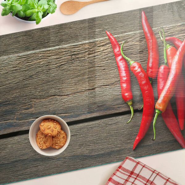 Tabla de cortar Chiles sobre un fondo de madera