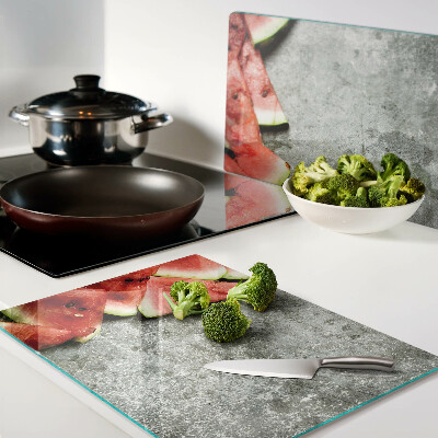 Tabla de cocina Rebanadas de sandía sobre un fondo gris