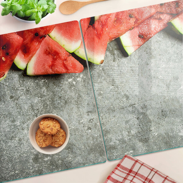 Tabla de cocina Rebanadas de sandía sobre un fondo gris