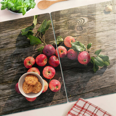 Tabla de cortar de cristal Manzanas sobre un fondo de madera