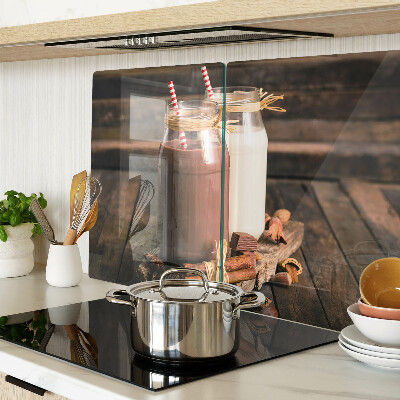 Tabla de cocina Frascos de bebidas sobre un fondo de madera