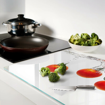 Tabla de cortar de cristal Tomates en agua