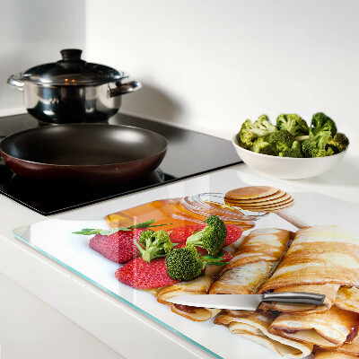 Tabla para cortar Panqueques con miel y fresas