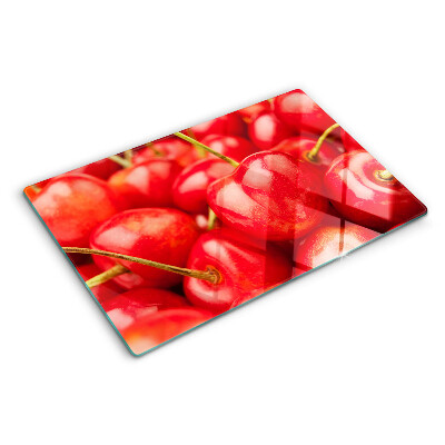 Tabla de cortar de cristal Cerezas sobre fondo rojo