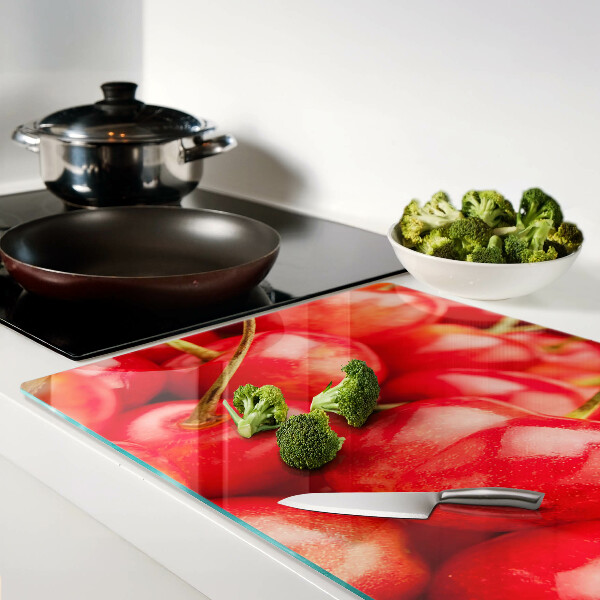 Tabla de cortar de cristal Cerezas sobre fondo rojo