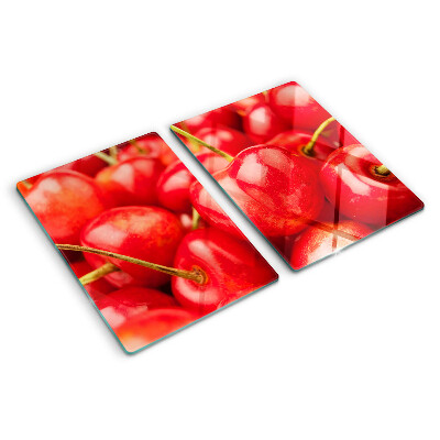 Tabla de cortar de cristal Cerezas sobre fondo rojo