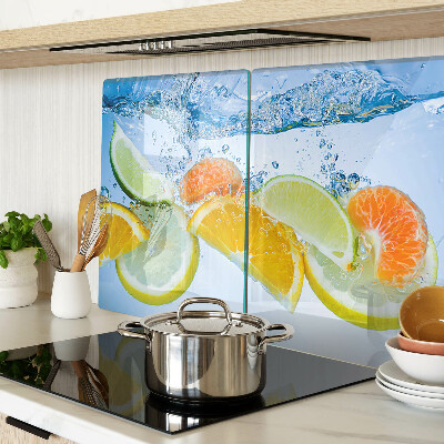 Tabla de cortar de cristal Frutas cítricas en agua