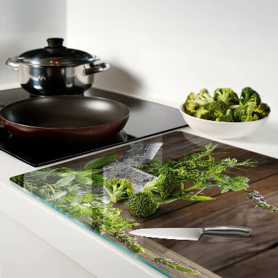 Tabla de cortar de cristal Hierbas en una olla