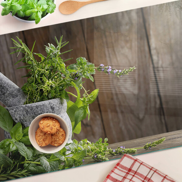 Tabla de cortar de cristal Hierbas en una olla