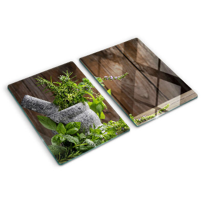 Tabla de cortar de cristal Hierbas en una olla