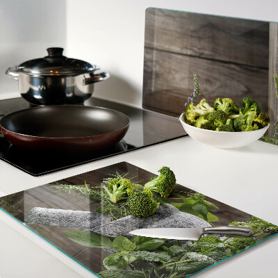 Tabla de cortar de cristal Hierbas en una olla