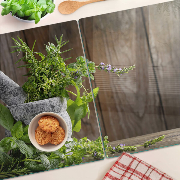 Tabla de cortar de cristal Hierbas en una olla