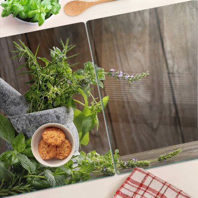 Tabla de cortar de cristal Hierbas en una olla