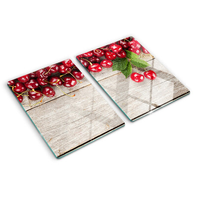 Tabla de cortar Cerezas sobre un fondo de madera