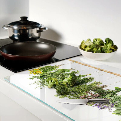 Tabla de cortar de cristal Hierbas secas en una cuerda