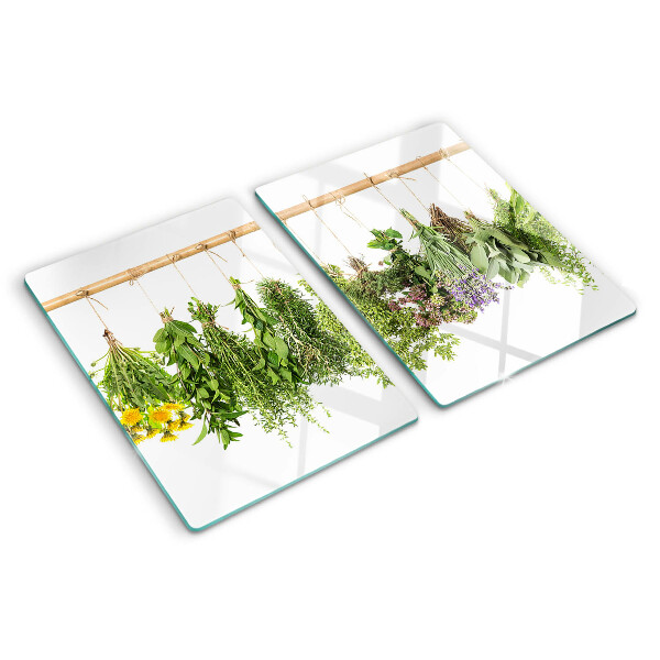 Tabla de cortar de cristal Hierbas secas en una cuerda