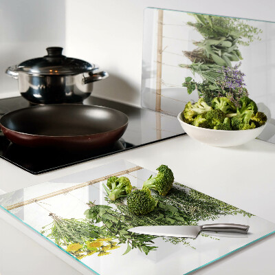 Tabla de cortar de cristal Hierbas secas en una cuerda