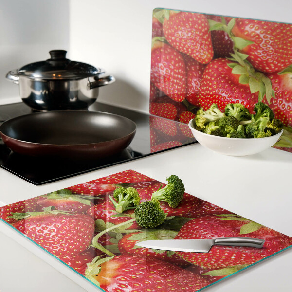 Tabla de cortar de cristal Fresas en el fondo