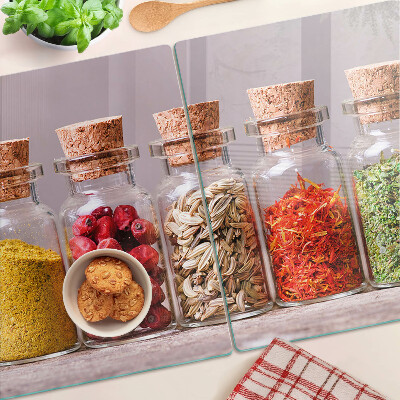 Tabla de cortar de cristal Especias en frascos de vidrio
