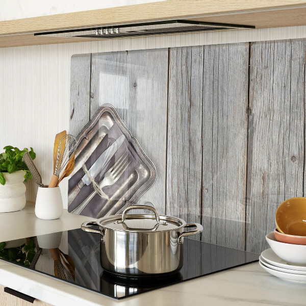 Tabla de cortar de cristal Cubiertos rústicos sobre fondo de madera.