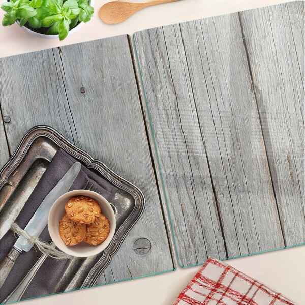 Tabla de cortar de cristal Cubiertos rústicos sobre fondo de madera.