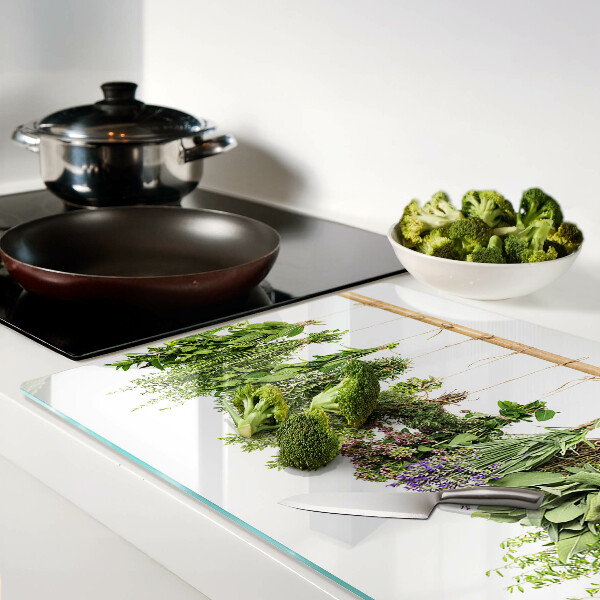 Tabla de cortar de cristal Hierbas secas en una cuerda