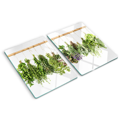 Tabla de cortar de cristal Hierbas secas en una cuerda