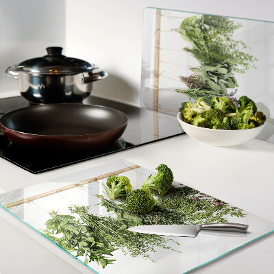 Tabla de cortar de cristal Hierbas secas en una cuerda