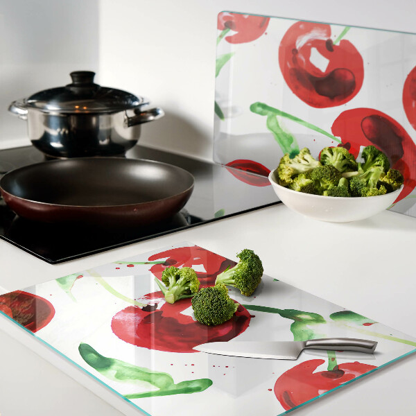 Tabla para cortar Cerezas rojas sobre fondo blanco