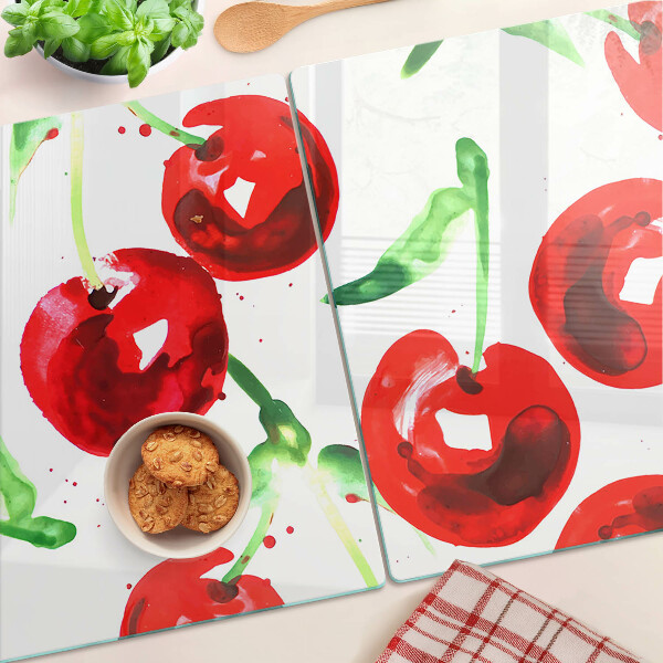 Tabla para cortar Cerezas rojas sobre fondo blanco