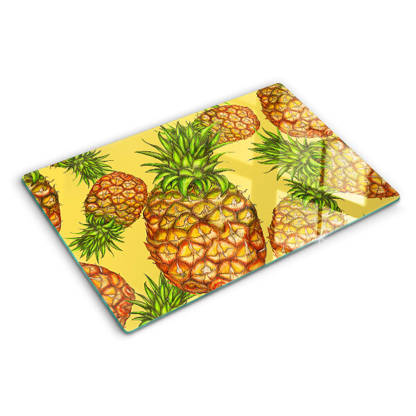 Tabla de cortar de cristal Piñas sobre un fondo amarillo