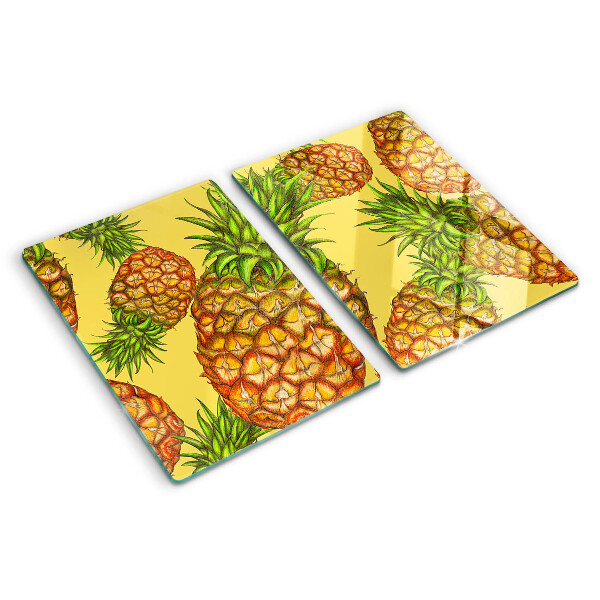 Tabla de cortar de cristal Piñas sobre un fondo amarillo