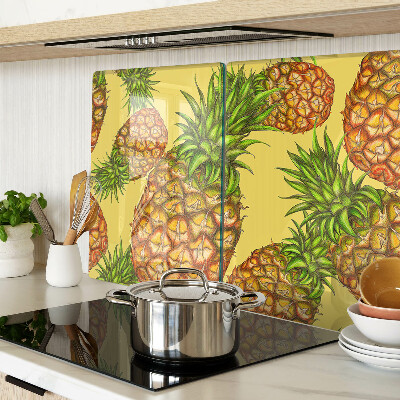 Tabla de cortar de cristal Piñas sobre un fondo amarillo