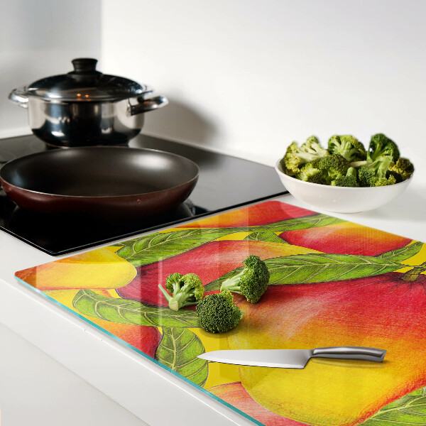 Tabla de cocina Pimientos sobre un fondo de hojas verdes