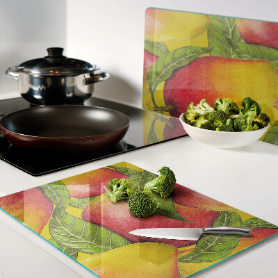 Tabla de cocina Pimientos sobre un fondo de hojas verdes