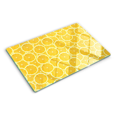 Tabla de cocina Rodajas de limón sobre un fondo amarillo