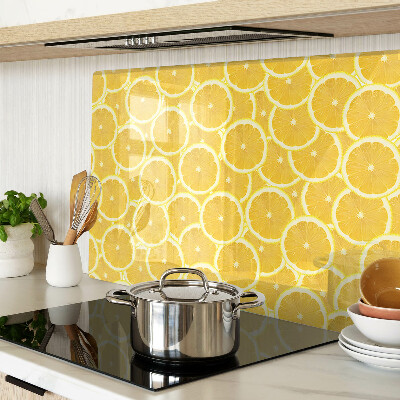 Tabla de cocina Rodajas de limón sobre un fondo amarillo