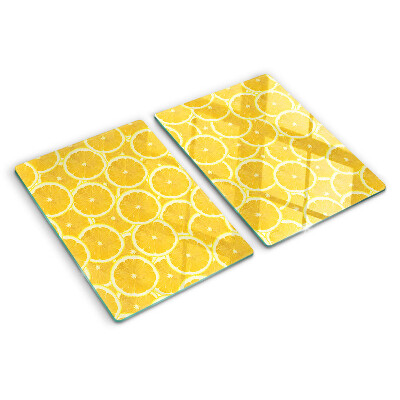 Tabla de cocina Rodajas de limón sobre un fondo amarillo