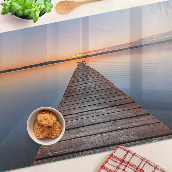 Tabla para cortar Muelle en el lago al atardecer