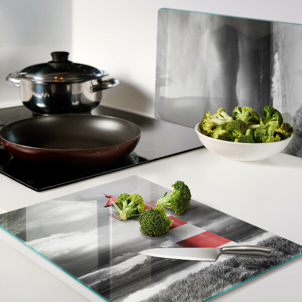 Tabla de cortar de cristal Un faro en el paisaje