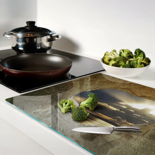 Tabla de cortar Vista del mar a través de la gruta