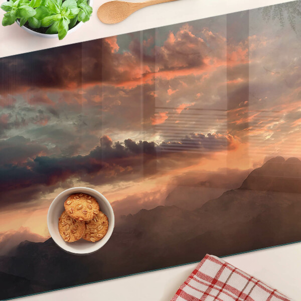 Tabla de cortar de cristal Puesta de sol sobre las montañas