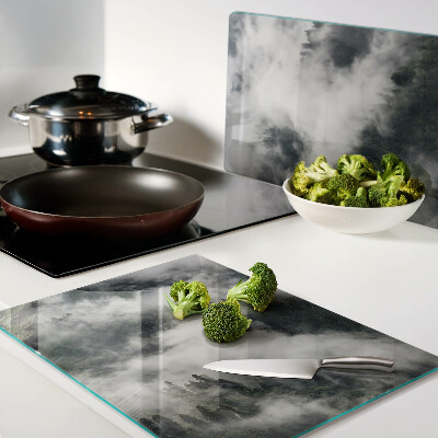 Tabla de cortar de cristal Montañas en las nubes