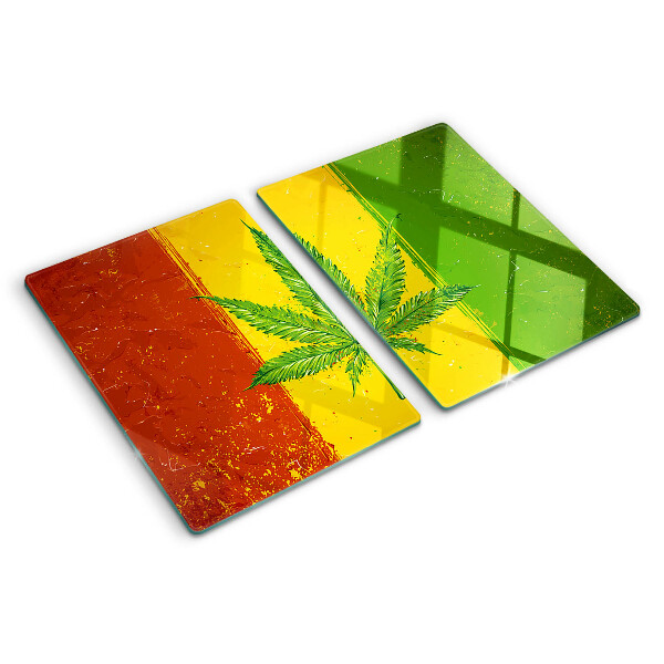 Tabla para cortar Hoja de cannabis sobre un fondo colorido