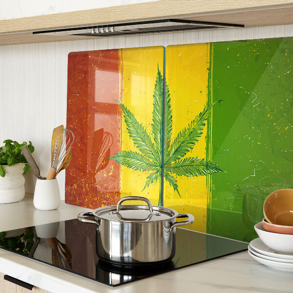 Tabla para cortar Hoja de cannabis sobre un fondo colorido