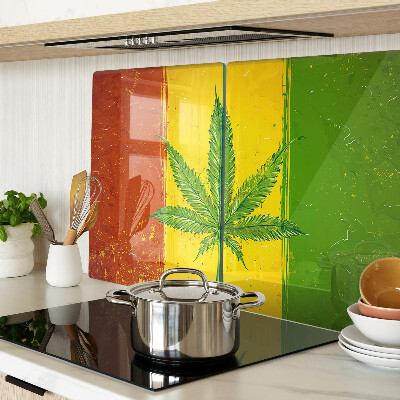 Tabla para cortar Hoja de cannabis sobre un fondo colorido