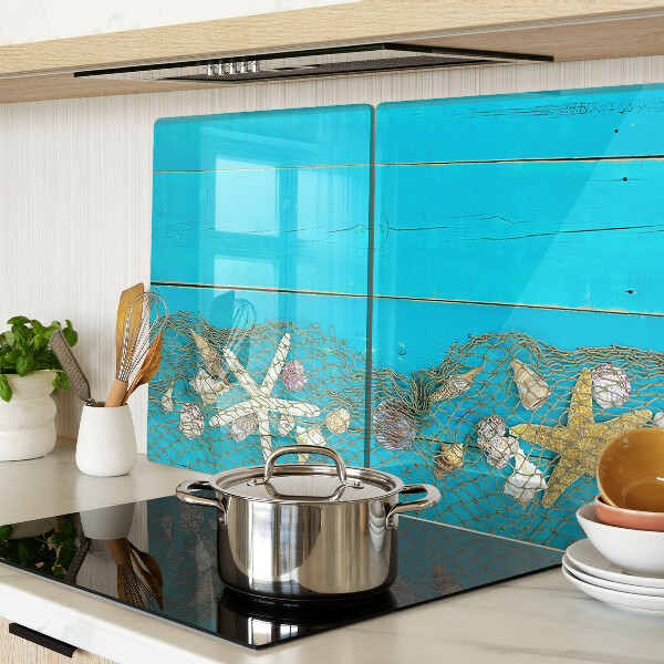 Tabla de cortar Conchas y estrellas de mar en una red