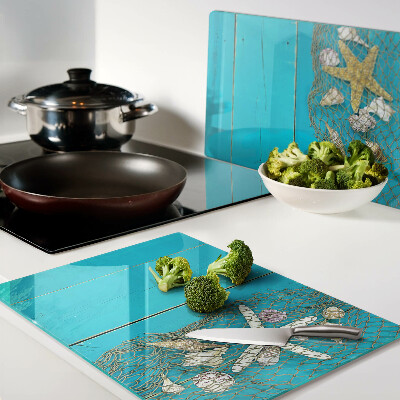 Tabla de cortar Conchas y estrellas de mar en una red